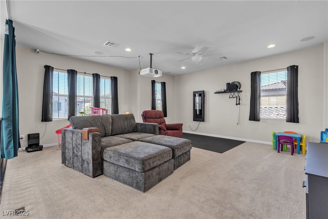 9950 Coyote Echo Court Las Vegas, NV 89166 - Photo 22 of 71 Carpeted living area featuring recessed lighting and a ceiling fan
