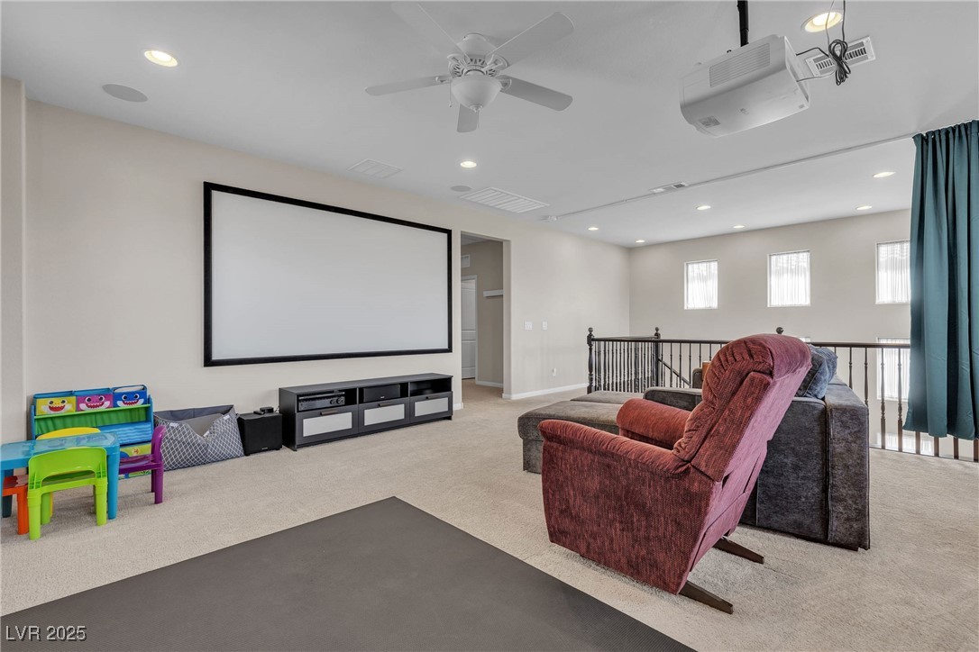 9950 Coyote Echo Court Las Vegas, NV 89166 - Photo 24 of 71 Cinema room with light carpet, recessed lighting, and a ceiling fan