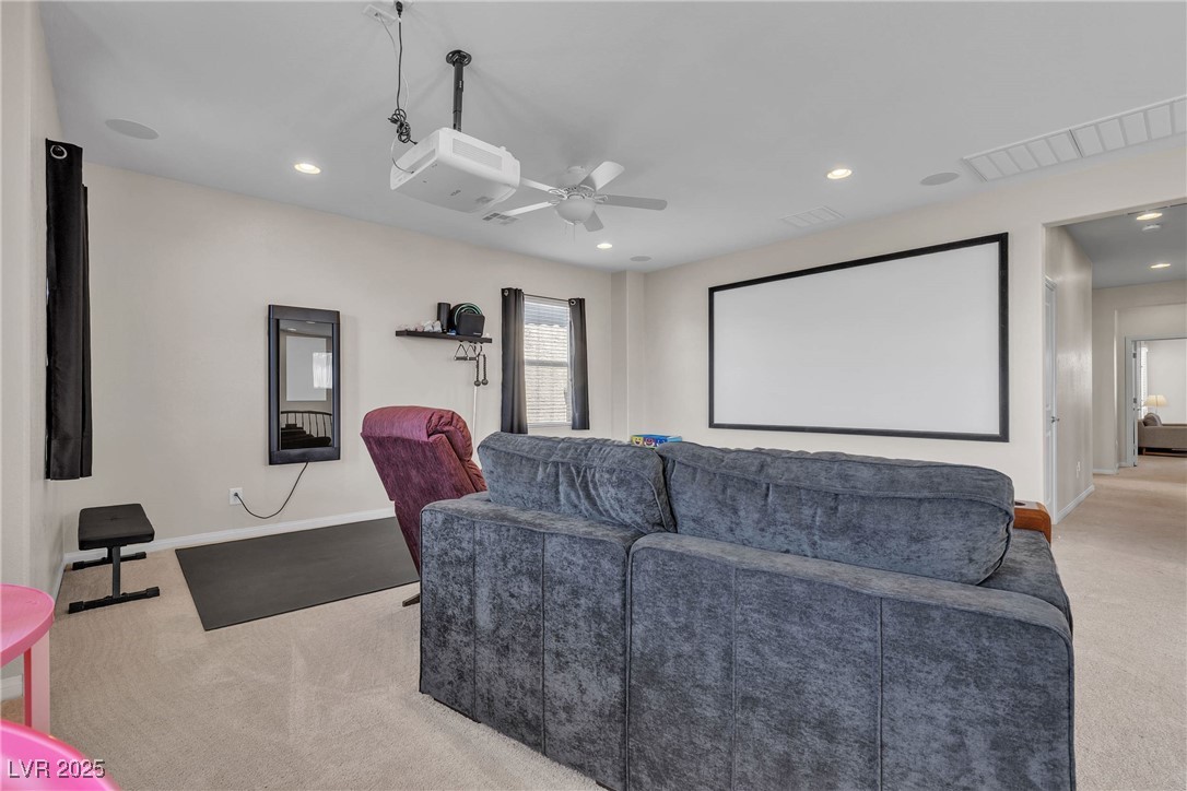 9950 Coyote Echo Court Las Vegas, NV 89166 - Photo 25 of 71 Home theater featuring ceiling fan, light carpet, and recessed lighting