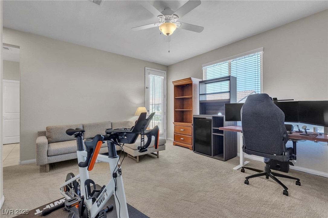 9950 Coyote Echo Court Las Vegas, NV 89166 - Photo 33 of 71 Office with light carpet and a ceiling fan