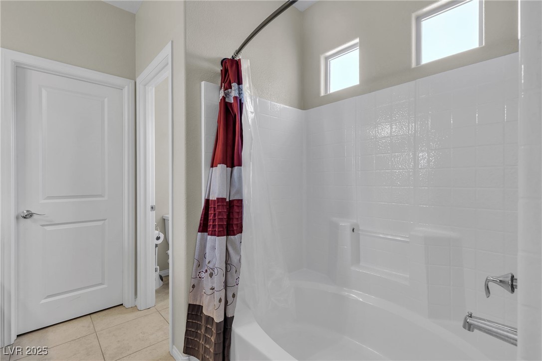 9950 Coyote Echo Court Las Vegas, NV 89166 - Photo 35 of 71 Full bath featuring shower / bath combo and light tile patterned floors