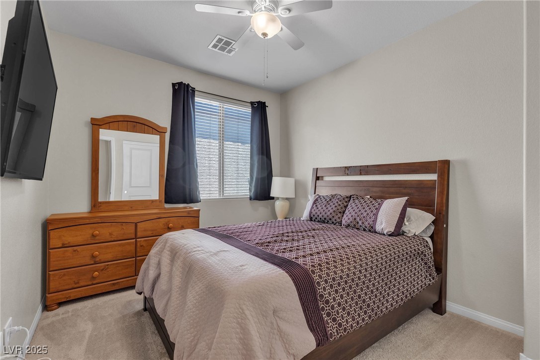 9950 Coyote Echo Court Las Vegas, NV 89166 - Photo 37 of 71 Bedroom featuring carpet floors and ceiling fan