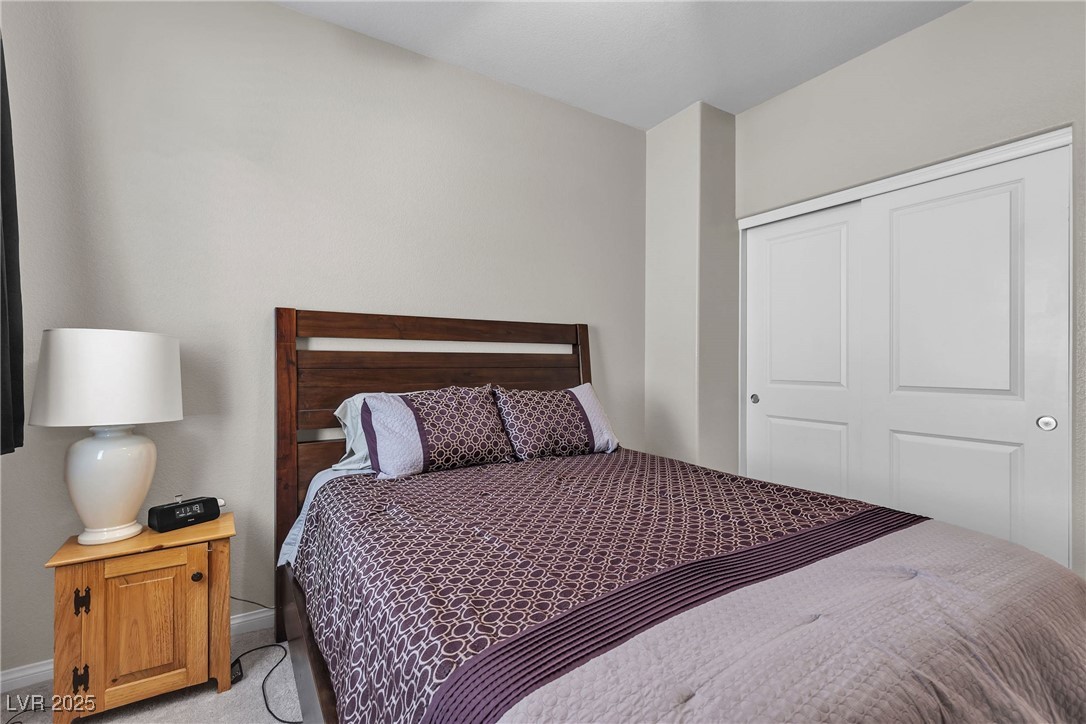 9950 Coyote Echo Court Las Vegas, NV 89166 - Photo 39 of 71 Carpeted bedroom with a closet