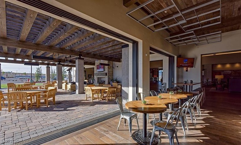 9950 Coyote Echo Court Las Vegas, NV 89166 - Photo 69 of 71 Dining space with hardwood / wood-style floors and a wood ceiling with exposed beams