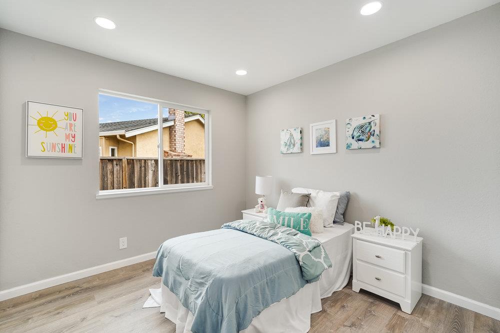 5642 Geranium Court Newark, CA 94560 - Photo 14 of 30 a bedroom with a bed and a window