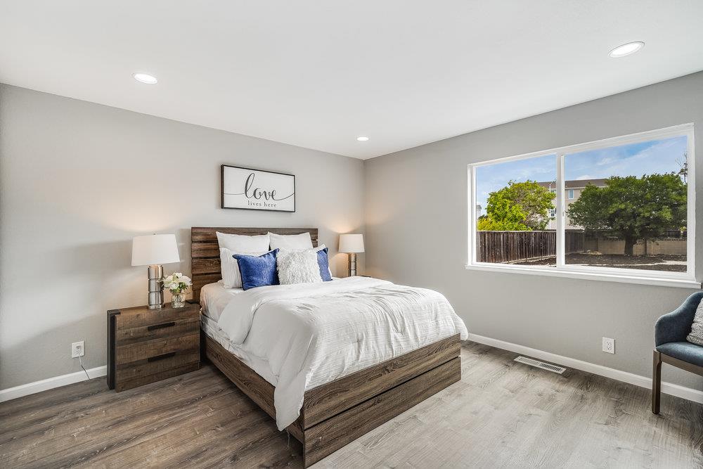 5642 Geranium Court Newark, CA 94560 - Photo 15 of 30 a bedroom with a bed and a large window