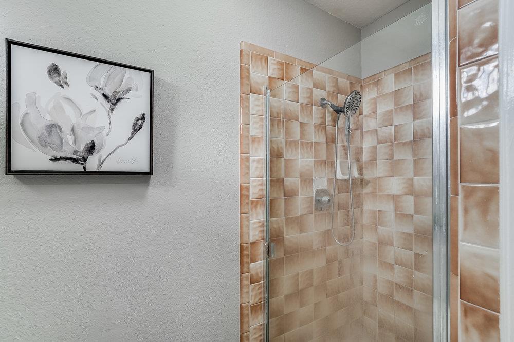 5642 Geranium Court Newark, CA 94560 - Photo 20 of 30 a bathroom with a shower and a sink