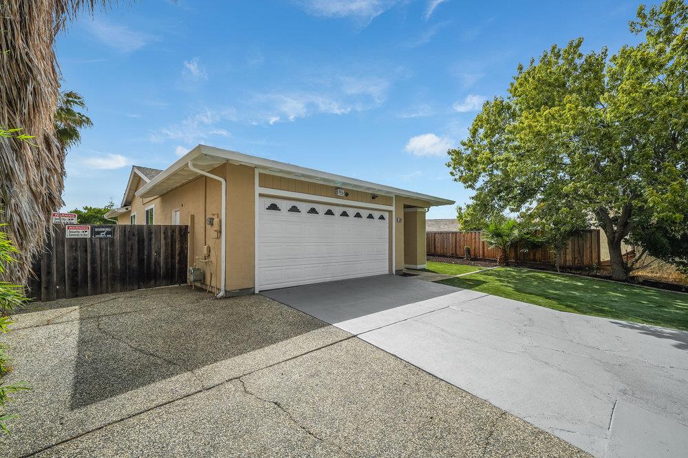 5642 Geranium Court Newark, CA 94560 - Photo 24 of 30 a view of a house with a yard and garage