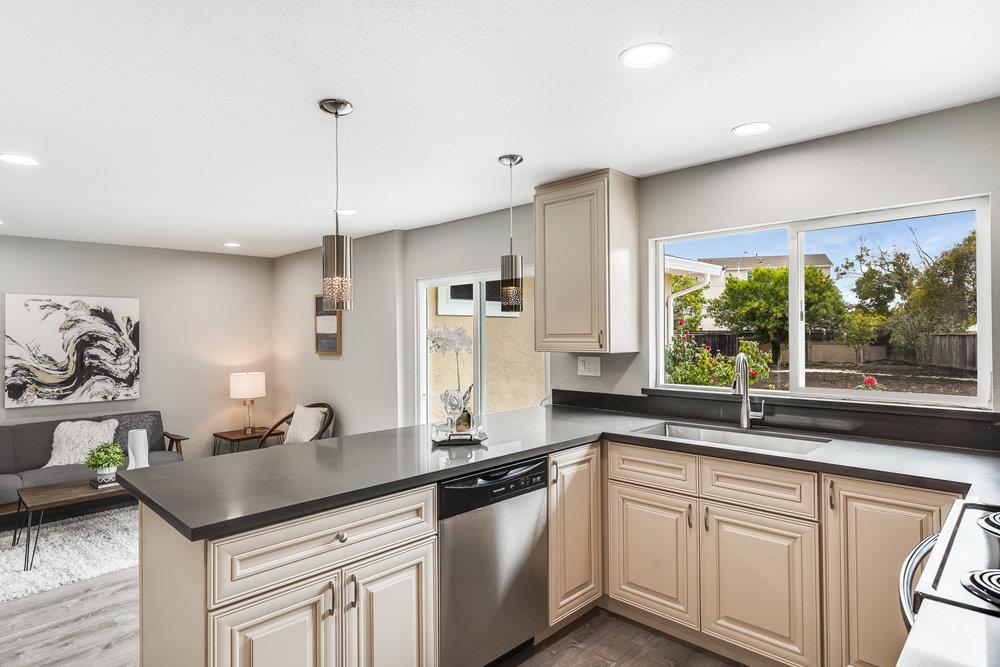 5642 Geranium Court Newark, CA 94560 - Photo 10 of 30 a kitchen with granite countertop a sink and a window