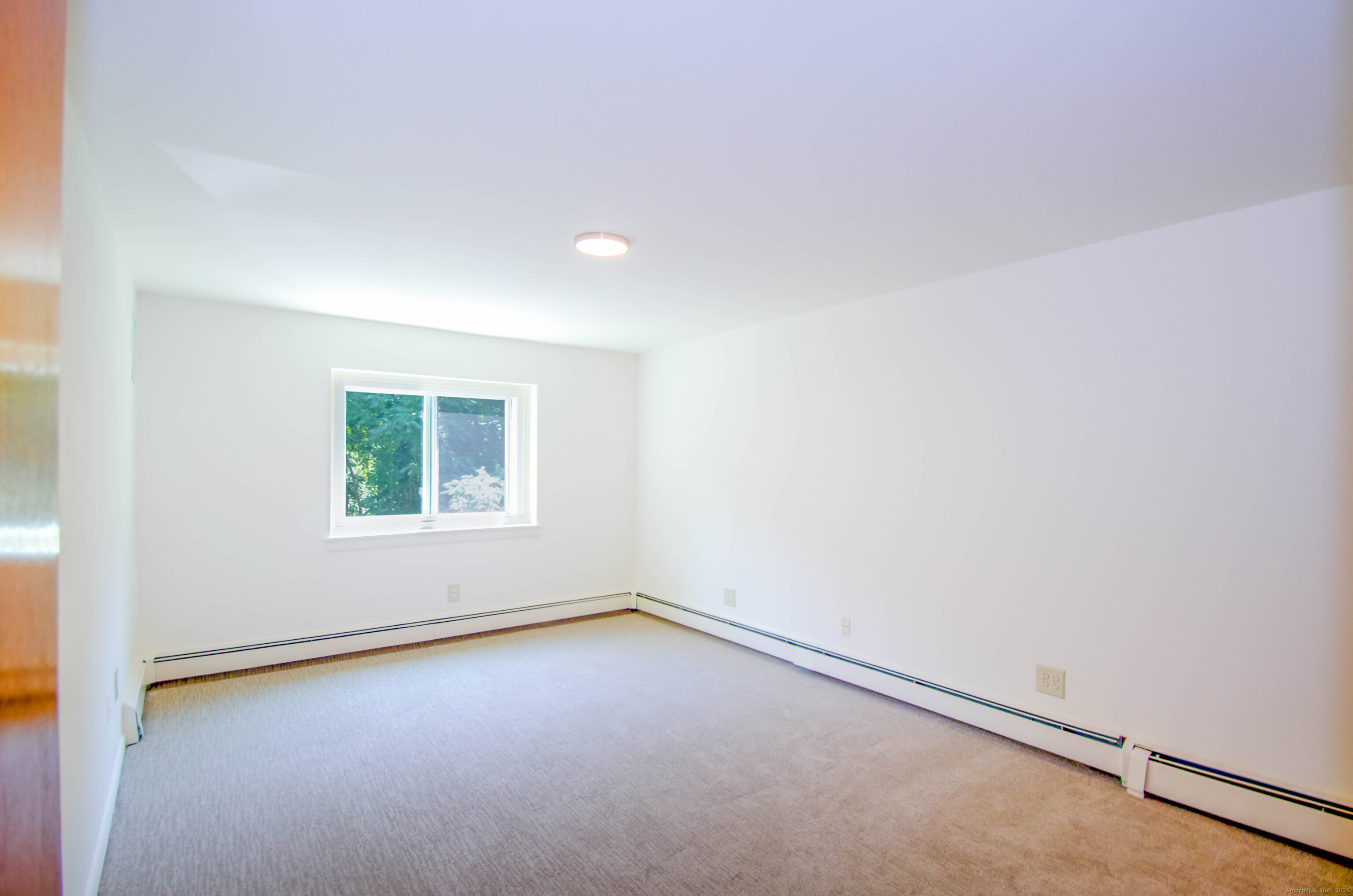 3900 Park Avenue, Unit 5H Bridgeport, CT 06604 - Photo 11 of 27 an empty room with a window