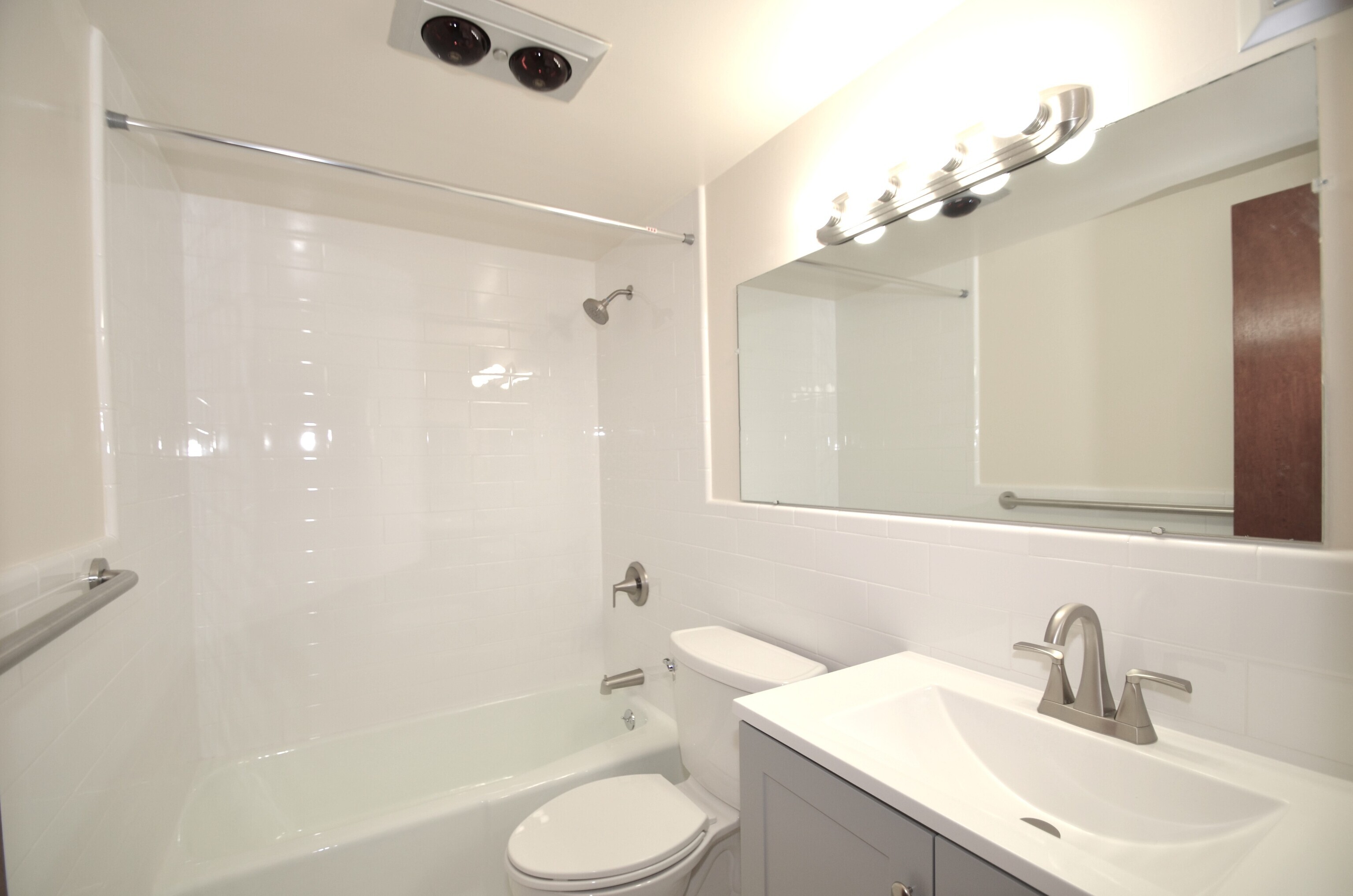 3900 Park Avenue, Unit 5H Bridgeport, CT 06604 - Photo 13 of 27 a bathroom with a sink a toilet and shower