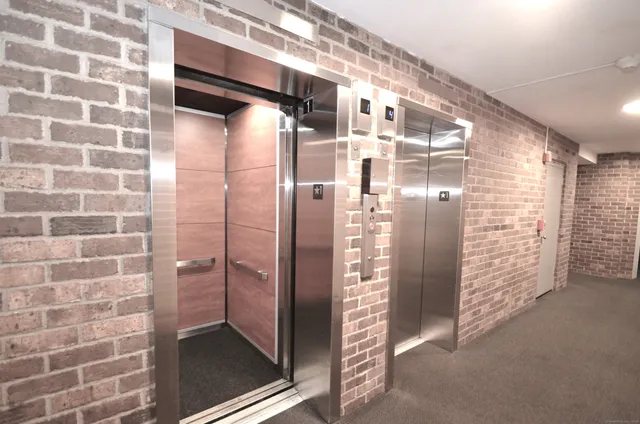 a bathroom with a shower and a glass door