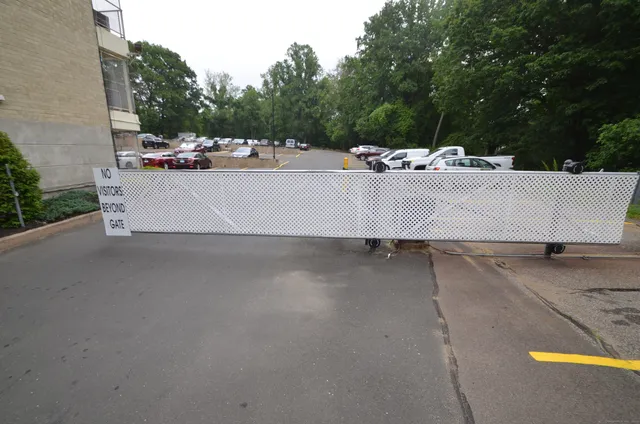 a view of a patio with a table and chairs and potted plants