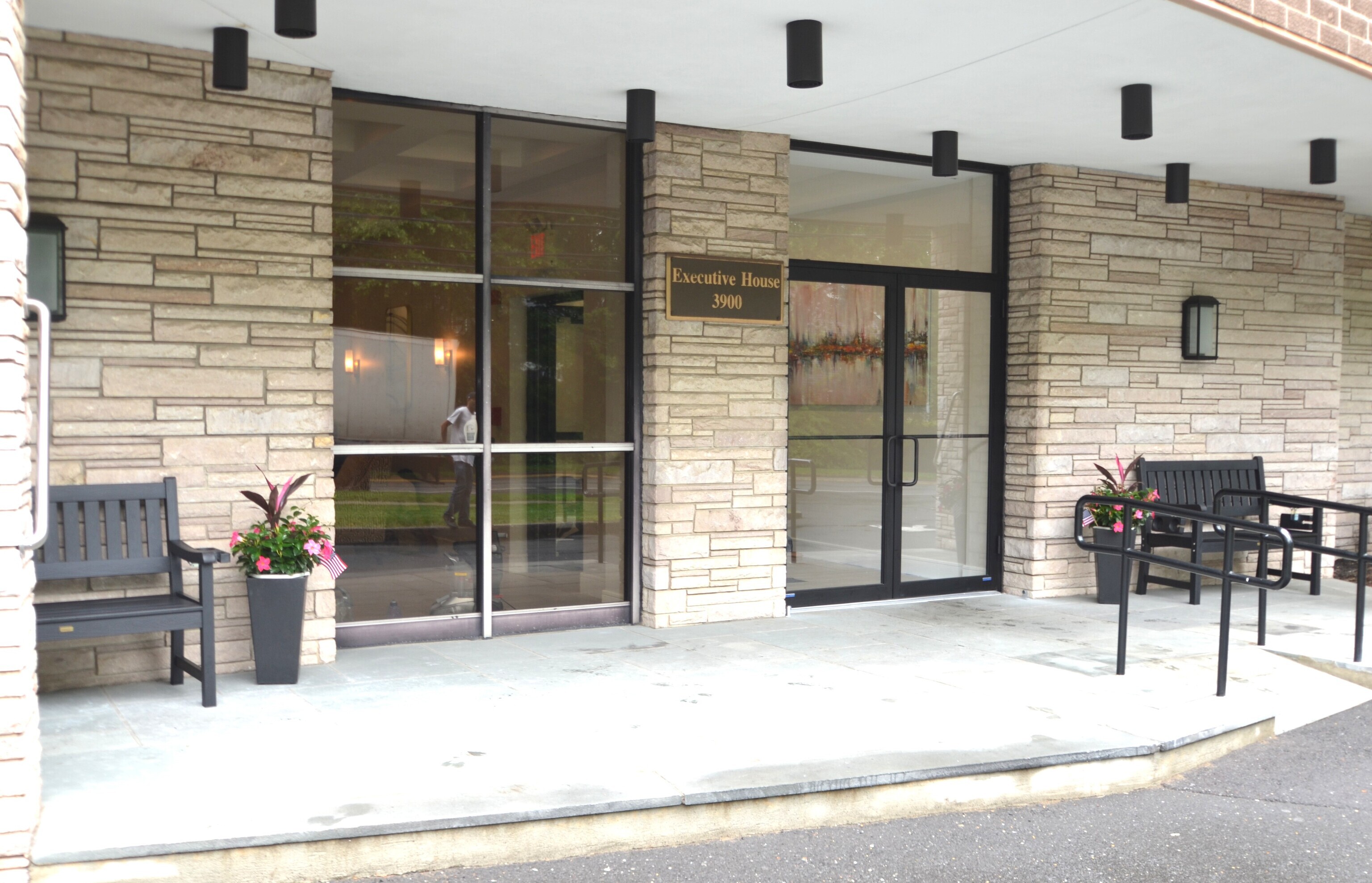 3900 Park Avenue, Unit 5H Bridgeport, CT 06604 - Photo 19 of 27 a view of a patio with a table and chairs and potted plants