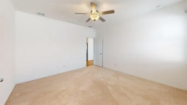 a view of a big room with carpet