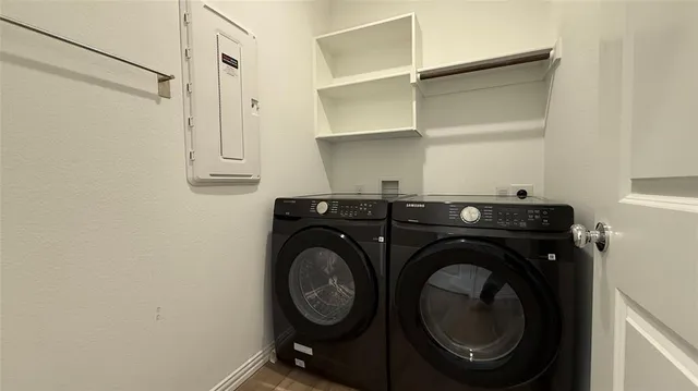 a utility room with dryer and washer