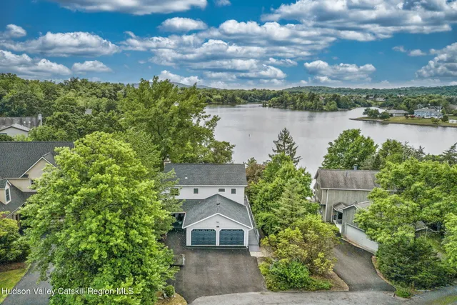 an aerial view of a house with lake view and mountain view