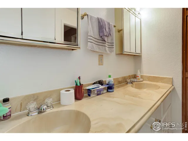 a kitchen with stainless steel appliances granite countertop a sink dishwasher and cabinets with wooden floor