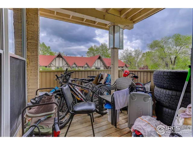 a view of a chairs and table in patio