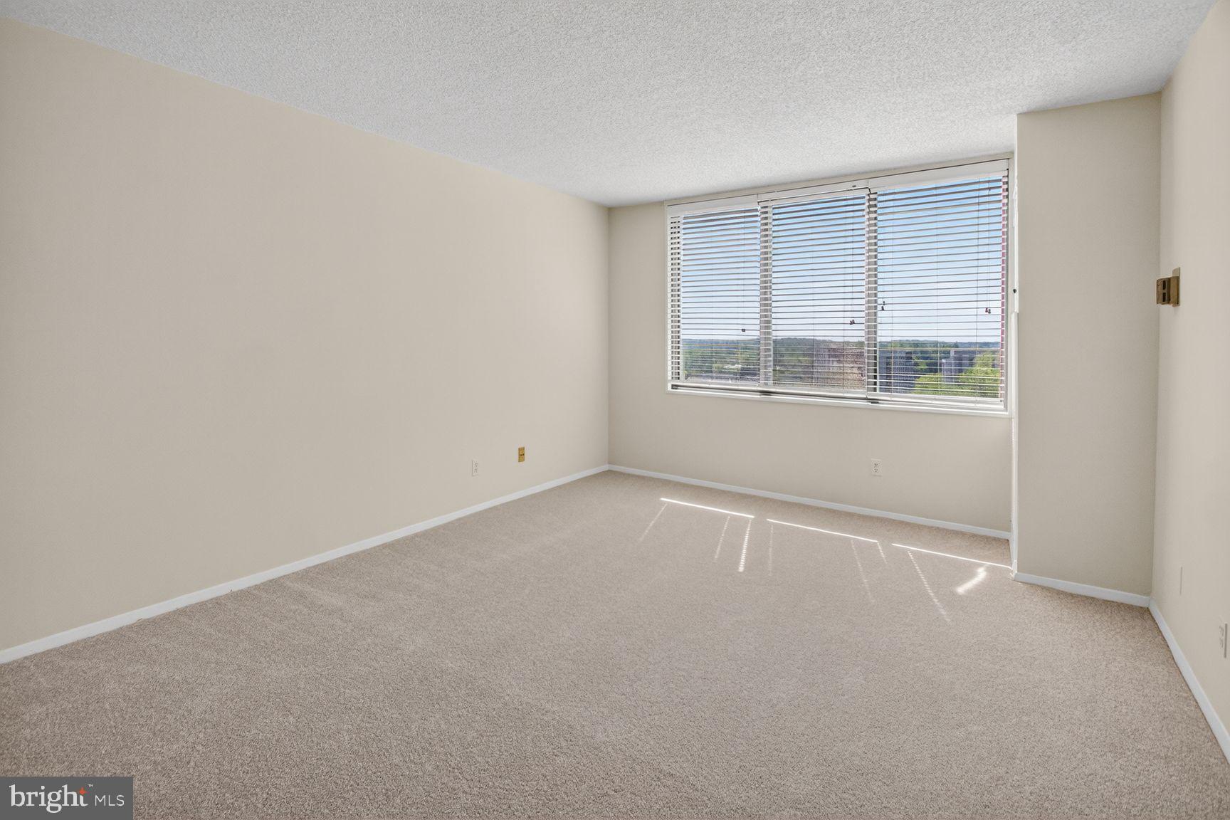 5225 Pooks Hill Road, Unit 1301N Bethesda, MD 20814 - Photo 11 of 26 an empty room with a window