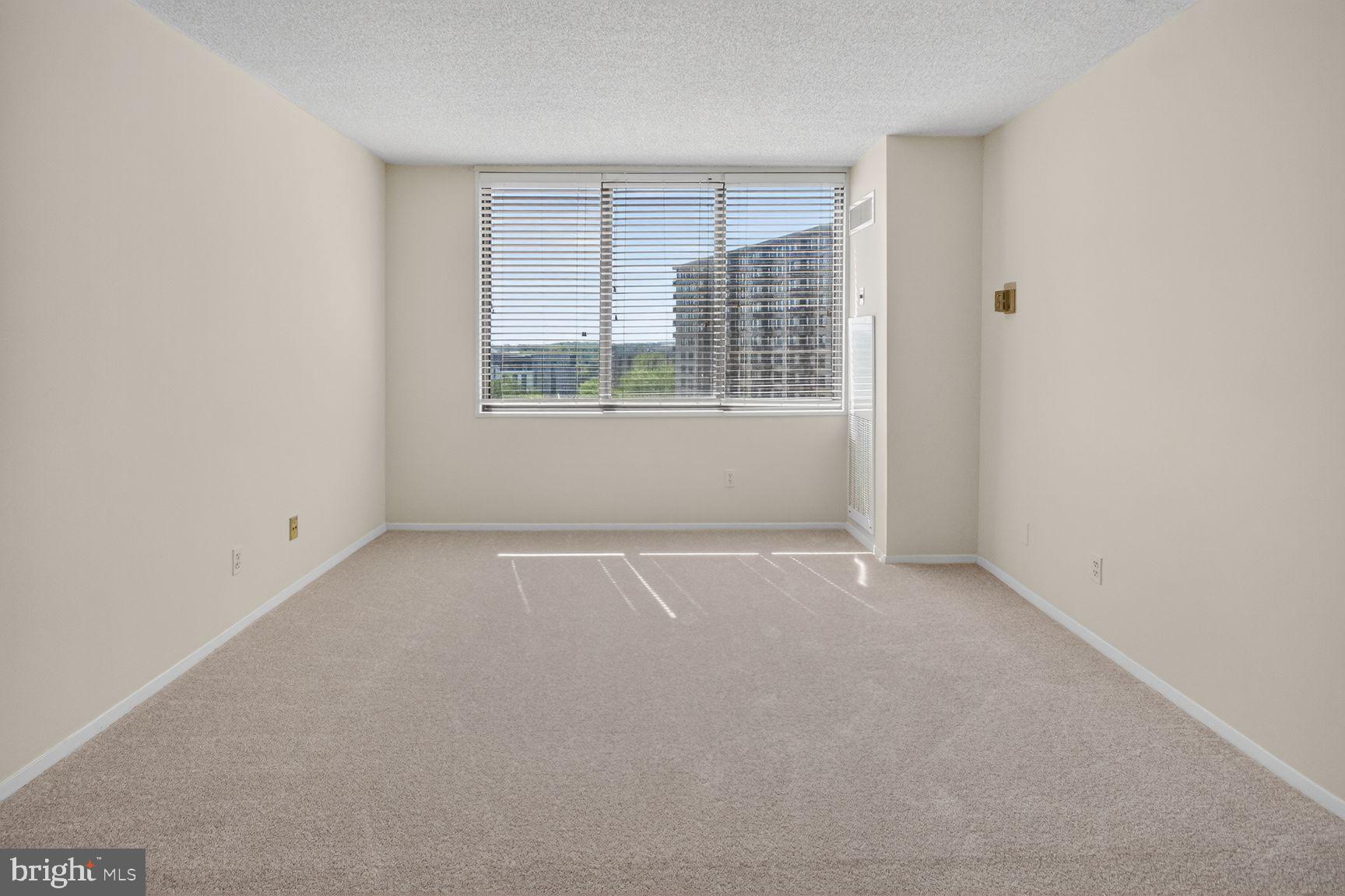 5225 Pooks Hill Road, Unit 1301N Bethesda, MD 20814 - Photo 12 of 26 an empty room with windows