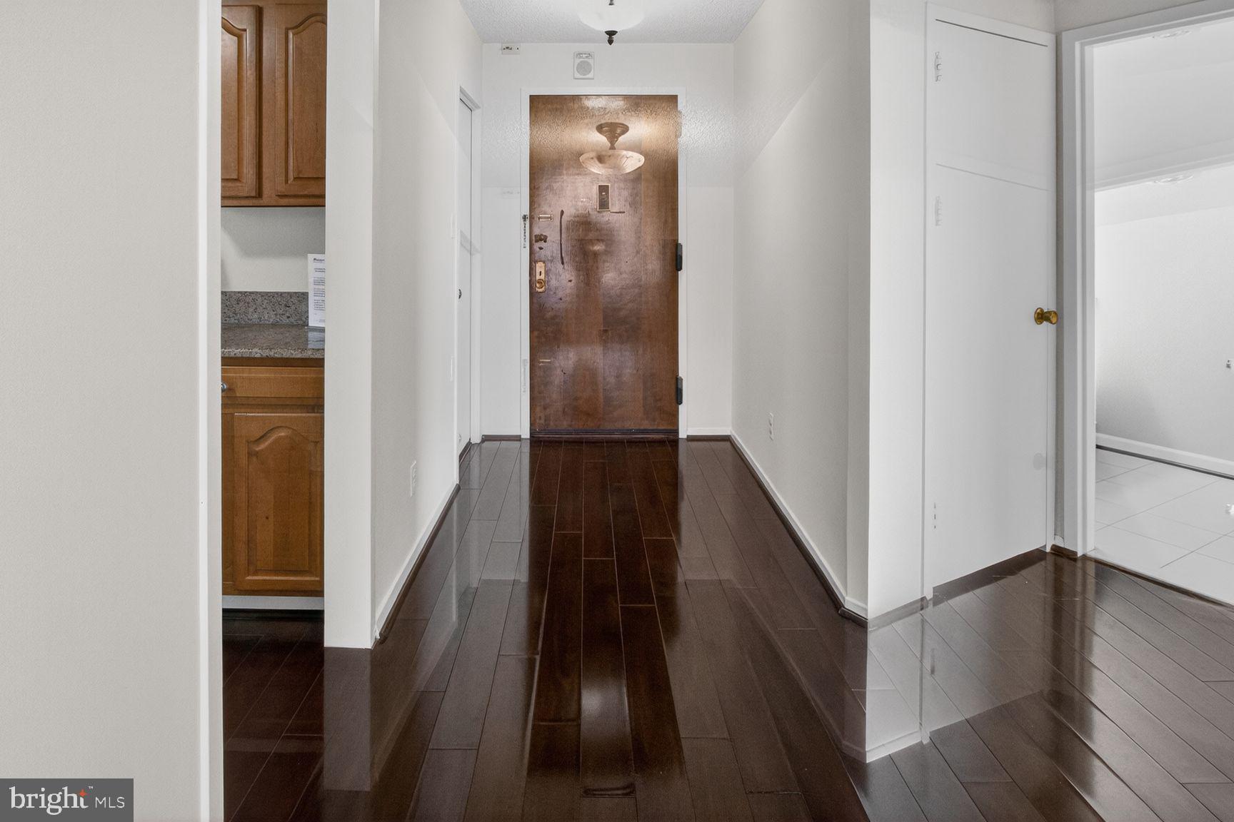 5225 Pooks Hill Road, Unit 1301N Bethesda, MD 20814 - Photo 2 of 26 a view of a hallway with wooden floor