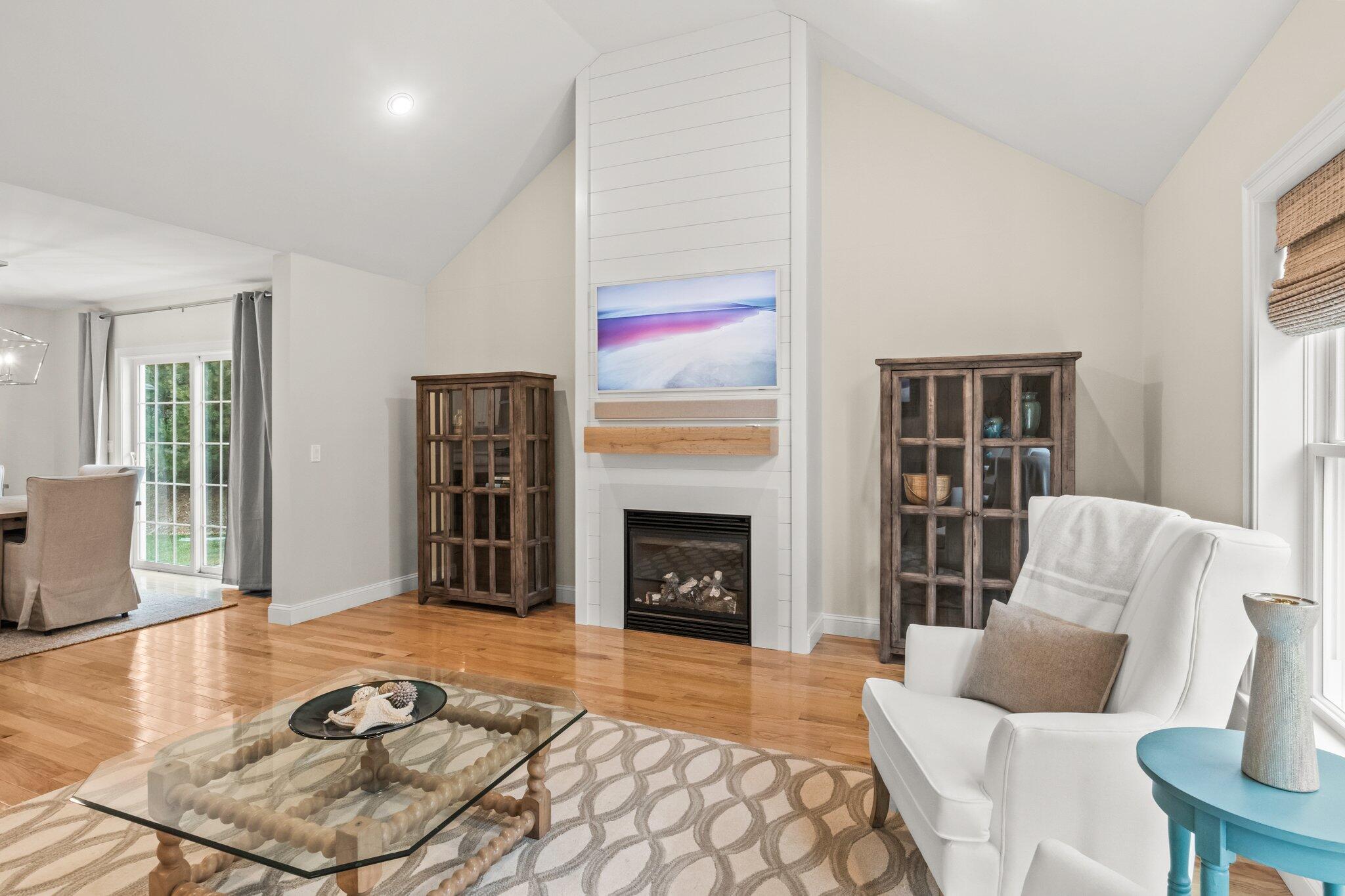 11 Azalea Lane Mashpee, MA 02649 - Photo 8 of 41 a living room with furniture and a fireplace