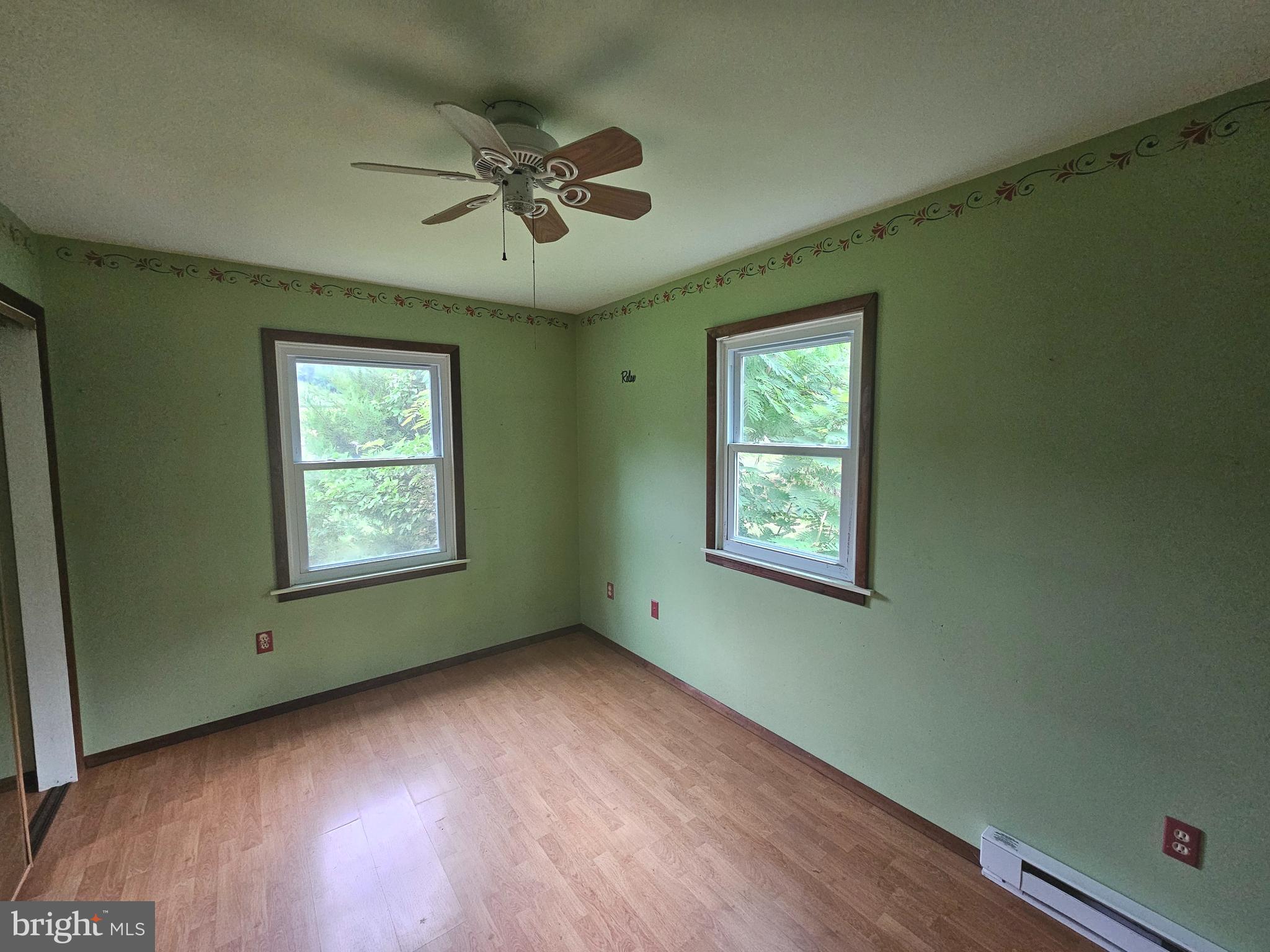 1093 Powells Valley Road Halifax, PA 17032 - Photo 2 of 10 a view of an empty room with a window and wooden floor