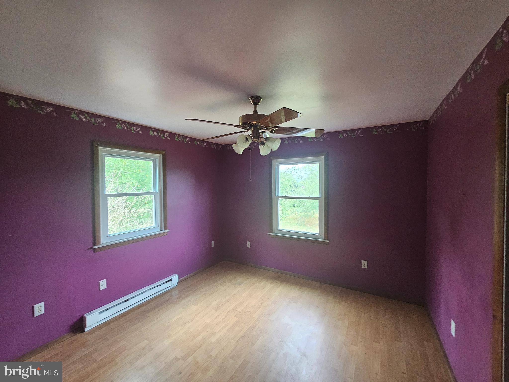 1093 Powells Valley Road Halifax, PA 17032 - Photo 3 of 10 a view of a livingroom with a window and a ceiling fan