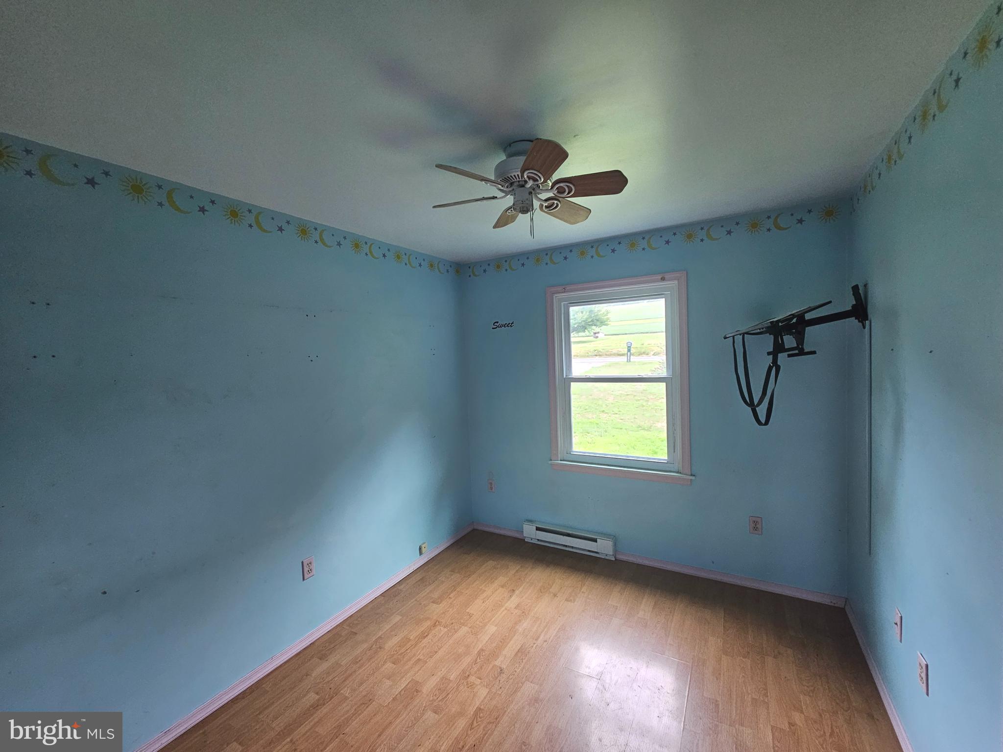 1093 Powells Valley Road Halifax, PA 17032 - Photo 4 of 10 a view of empty room with wooden floor and fan