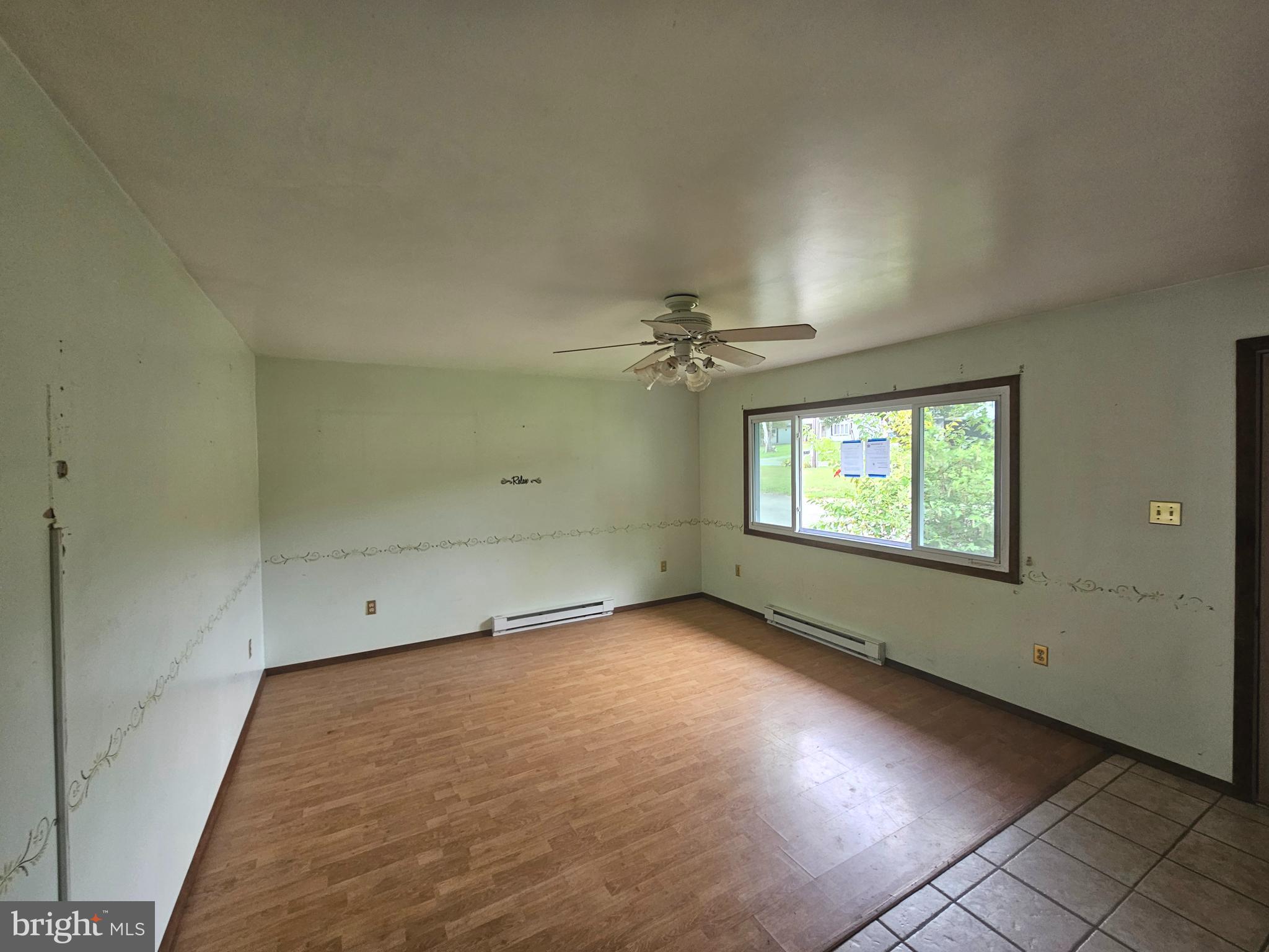 1093 Powells Valley Road Halifax, PA 17032 - Photo 6 of 10 an empty room with a empty space and windows