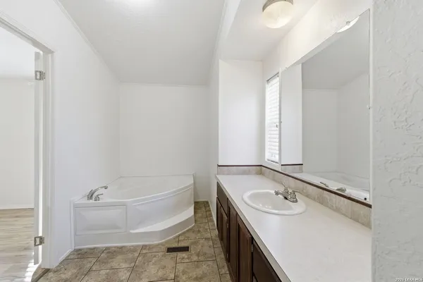 a bathroom with a sink a toilet and tub