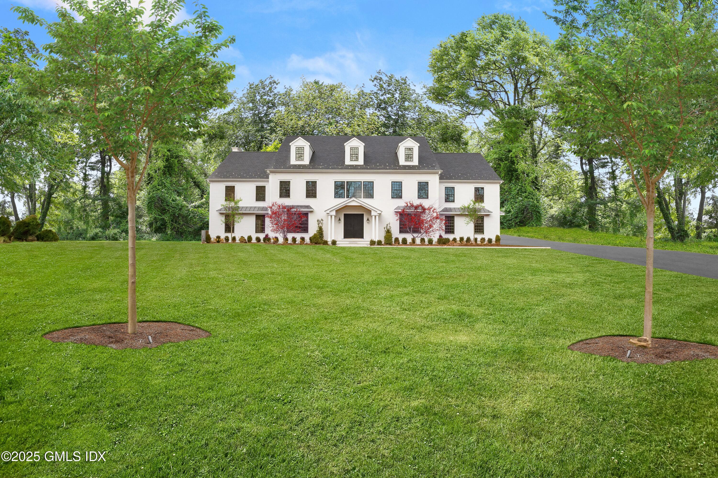 11 Winterset Road Greenwich, CT 06830 - Photo 3 of 14 a view of a house with a yard