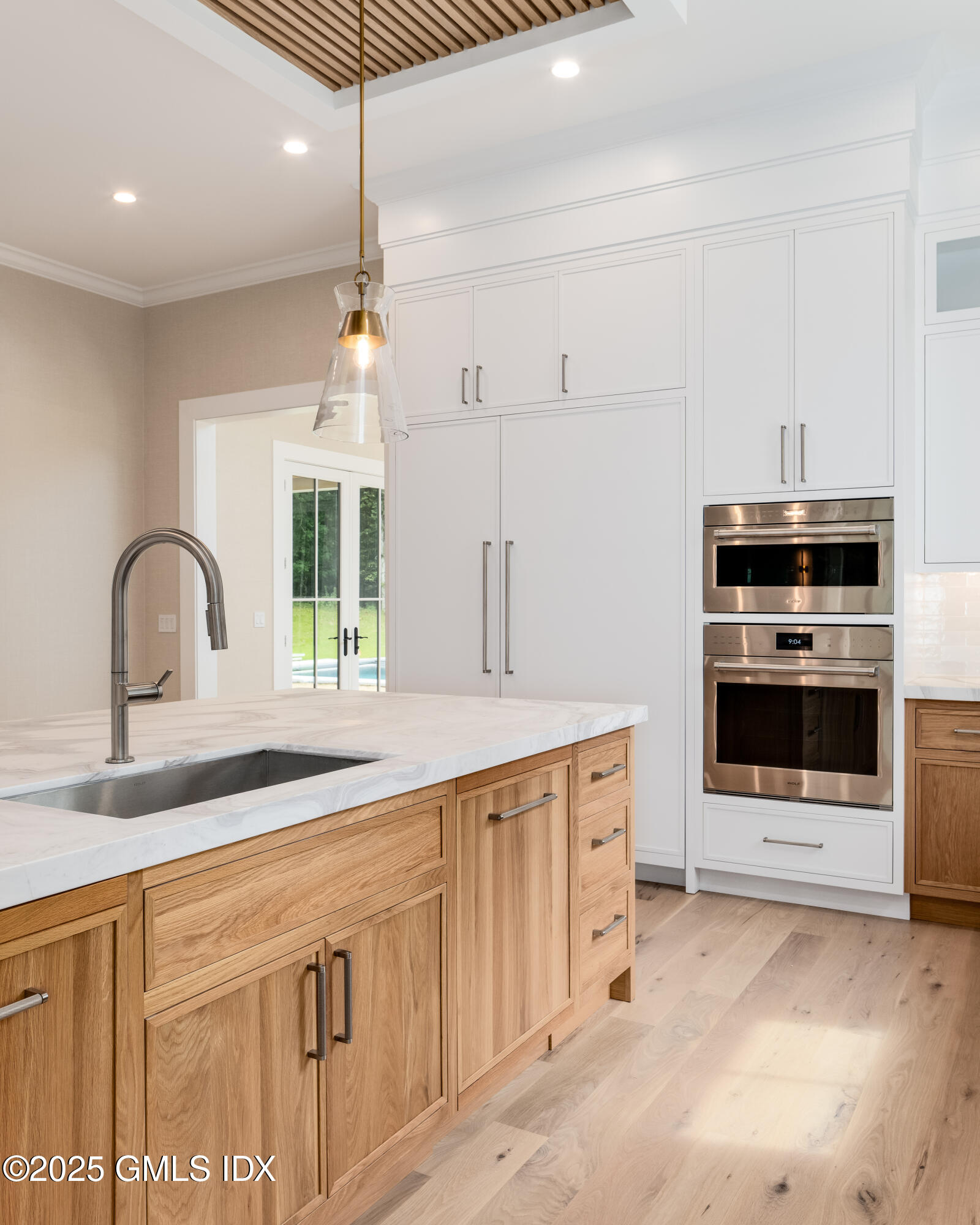 11 Winterset Road Greenwich, CT 06830 - Photo 5 of 14 a kitchen with stainless steel appliances granite countertop a sink and cabinets with wooden floor