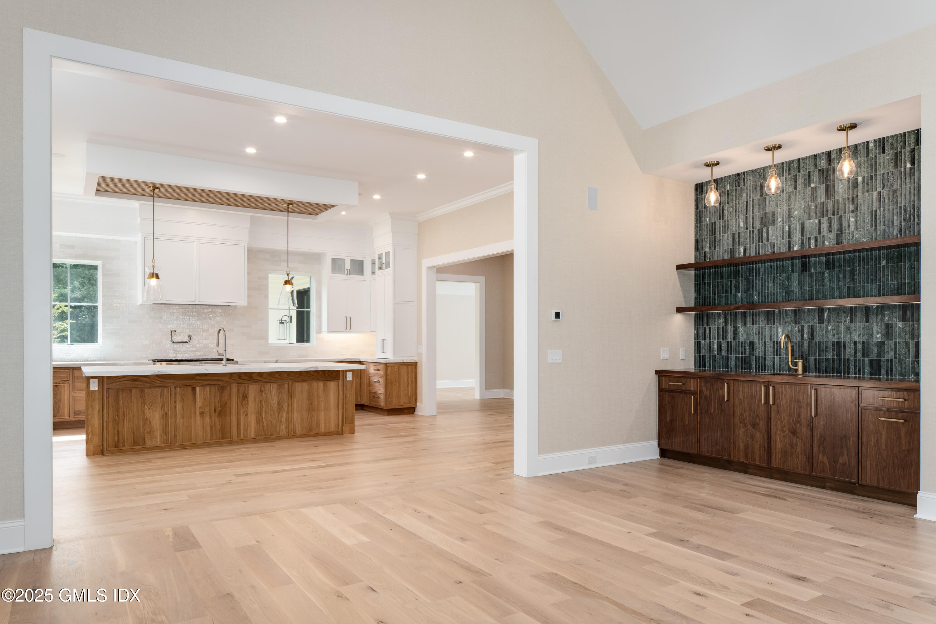 11 Winterset Road Greenwich, CT 06830 - Photo 6 of 14 a large kitchen with a wooden floor and a large window