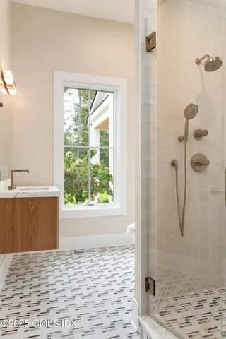 a bathroom with a bathtub and shower