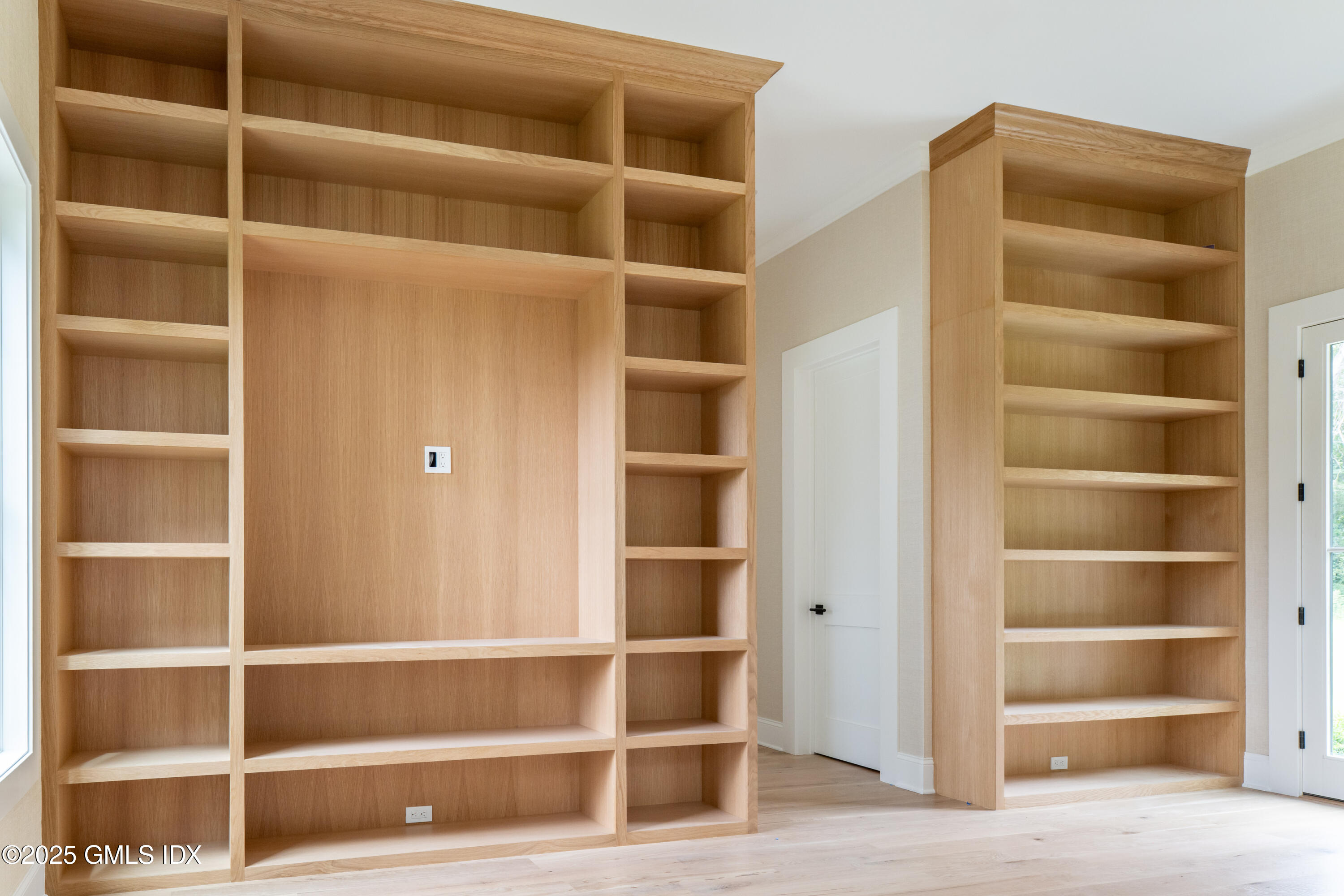 11 Winterset Road Greenwich, CT 06830 - Photo 10 of 14 a view of an empty room with empty shelves
