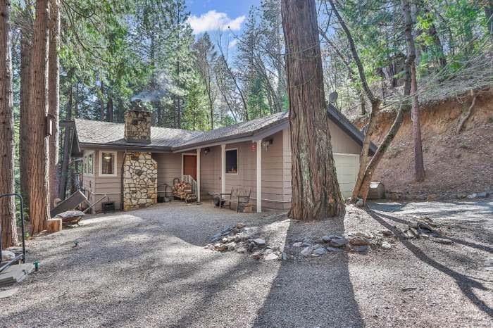 4599 Rivendale Road Placerville, CA 95667 - Photo 23 of 27 front view of a house with a large tree and wooden fence