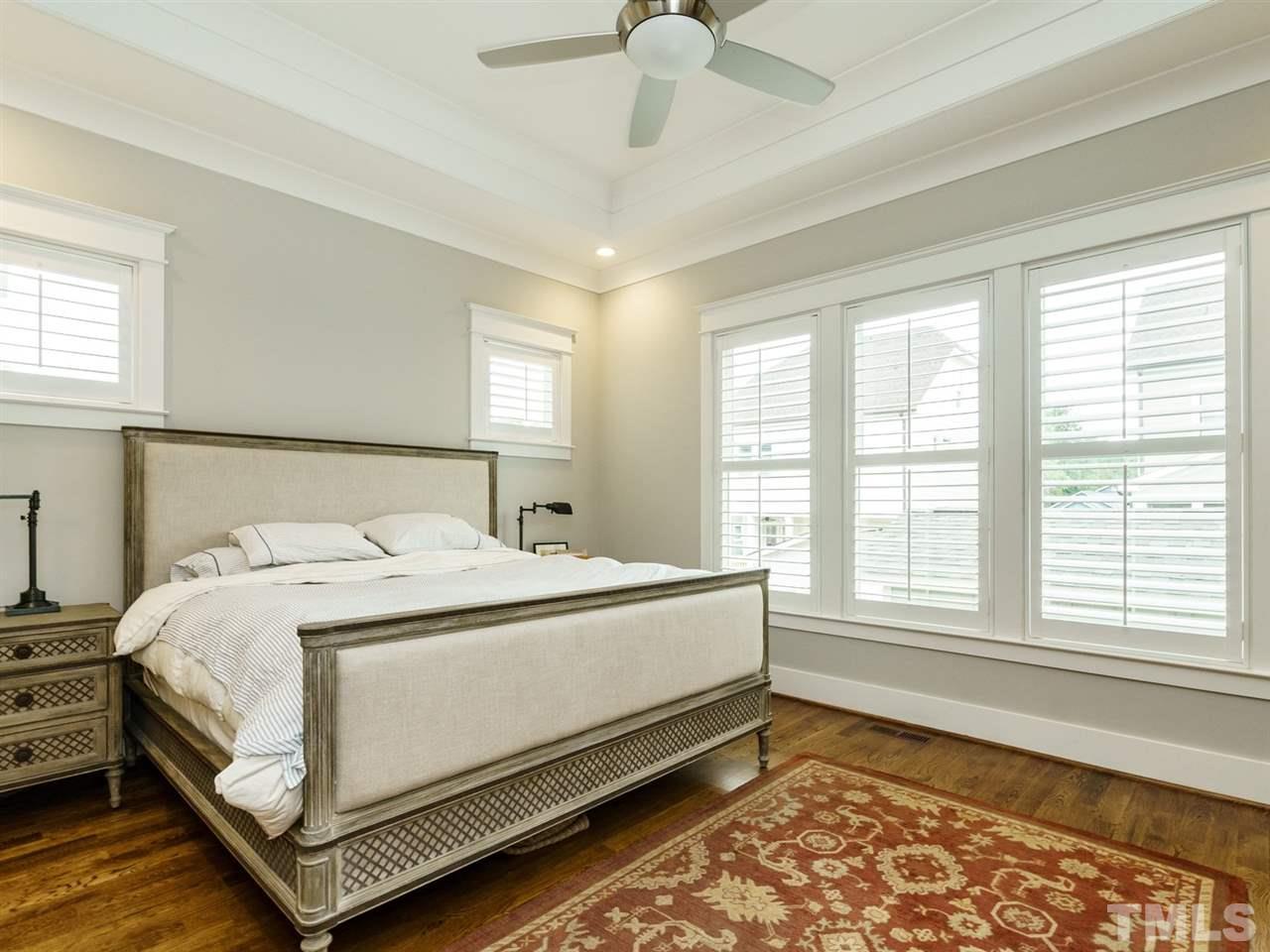 710 Virginia Avenue Raleigh, NC 27604 - Photo 11 of 25 a bed sitting in a bedroom next to a window