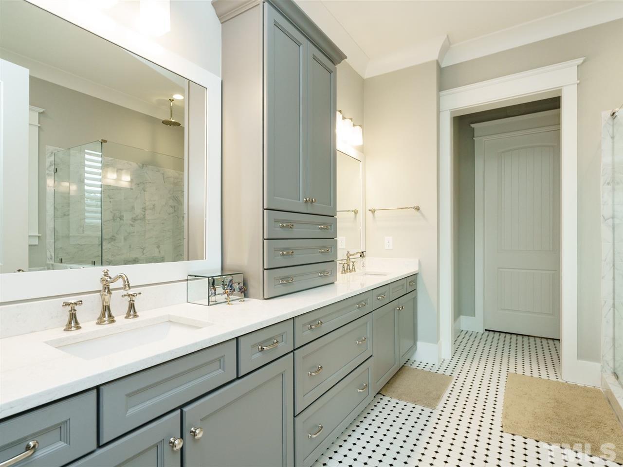710 Virginia Avenue Raleigh, NC 27604 - Photo 12 of 25 a bathroom with a sink a mirror and a shower