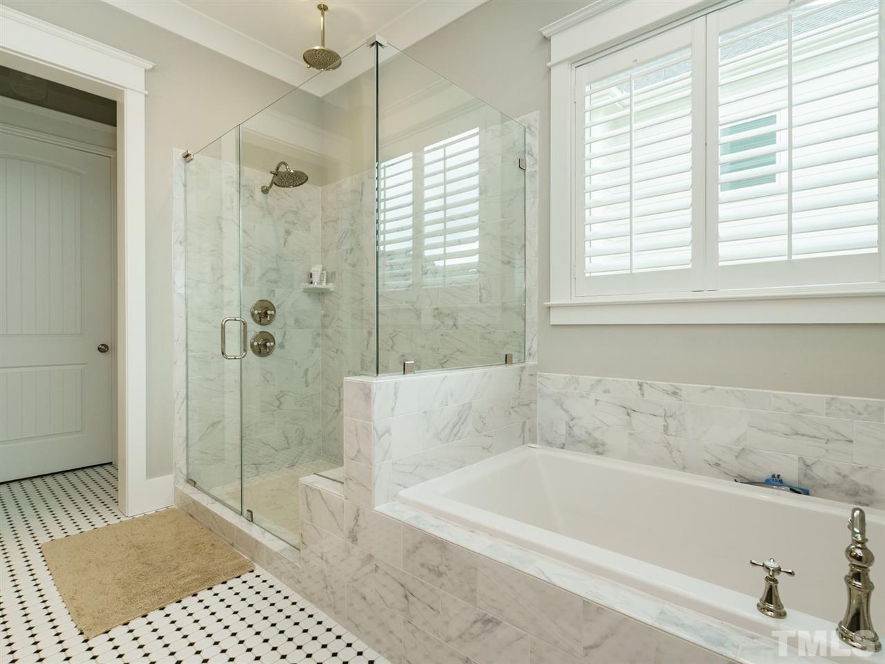 710 Virginia Avenue Raleigh, NC 27604 - Photo 13 of 25 a bathroom with a bathtub and a shower