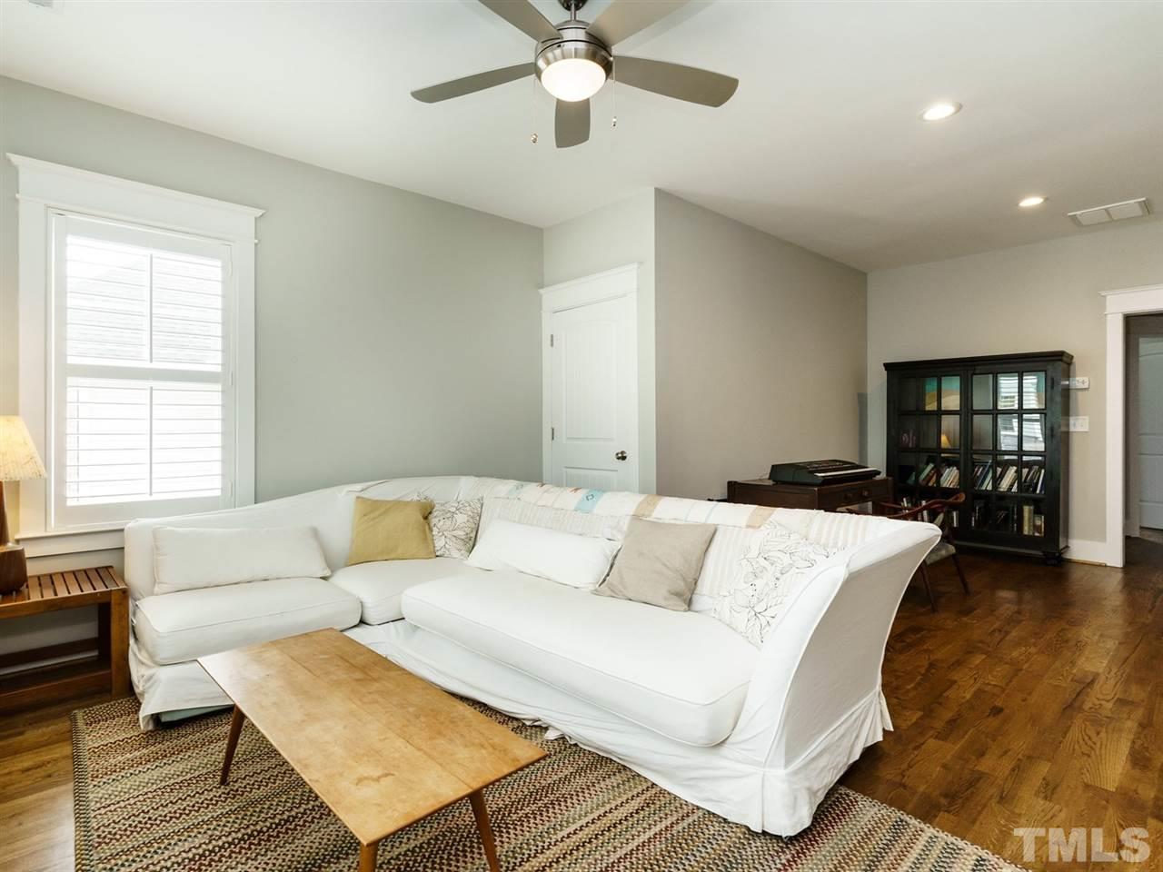 710 Virginia Avenue Raleigh, NC 27604 - Photo 15 of 25 a living room with furniture and a wooden floor