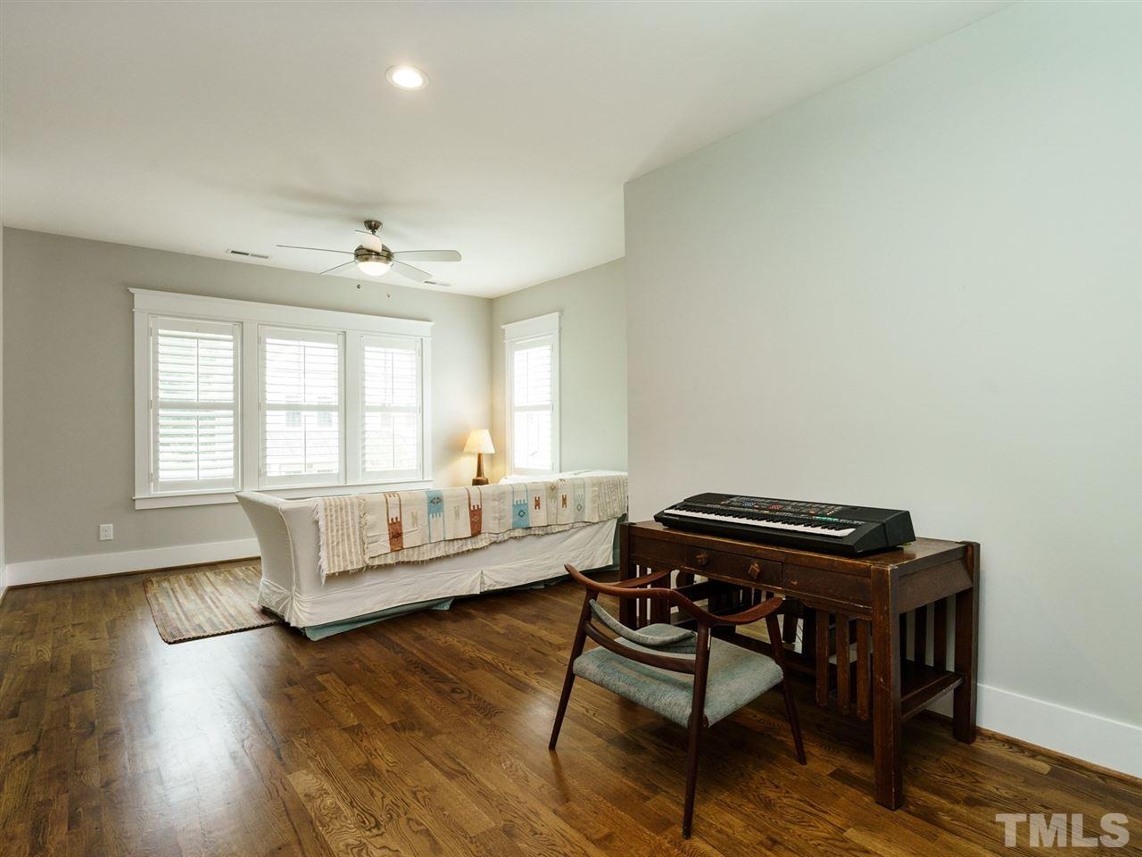 710 Virginia Avenue Raleigh, NC 27604 - Photo 16 of 25 a living room with furniture and a wooden floor