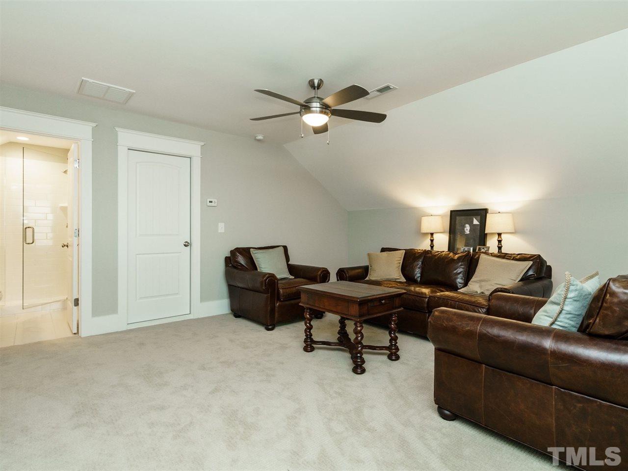 710 Virginia Avenue Raleigh, NC 27604 - Photo 22 of 25 a living room with furniture and a ceiling fan
