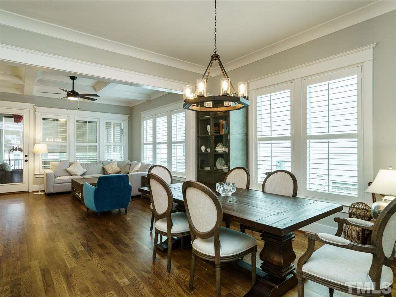 710 Virginia Avenue Raleigh, NC 27604 - Photo 4 of 25 a dining room with furniture a chandelier and wooden floor