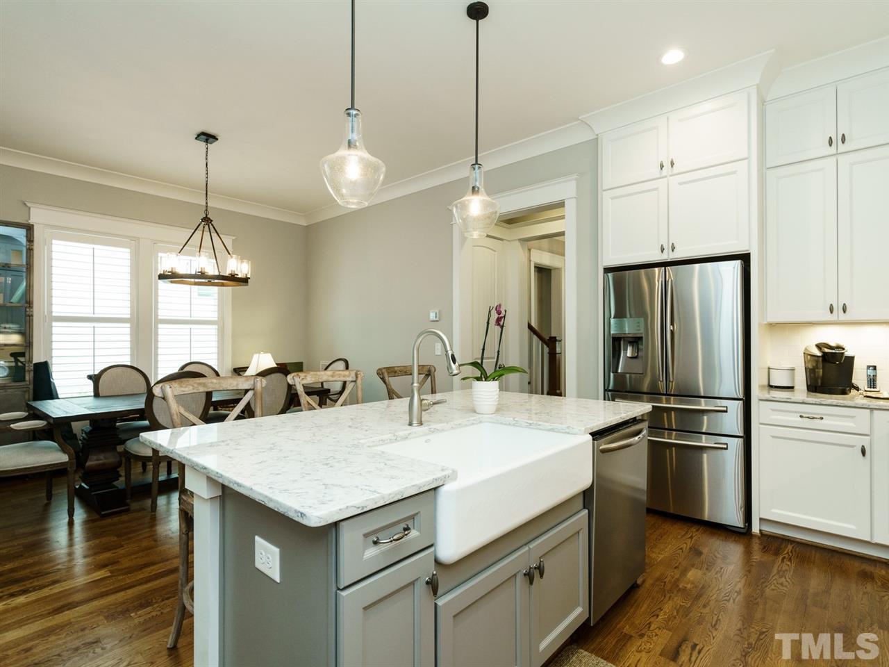 710 Virginia Avenue Raleigh, NC 27604 - Photo 7 of 25 a kitchen that has a lot of cabinets and refrigerator