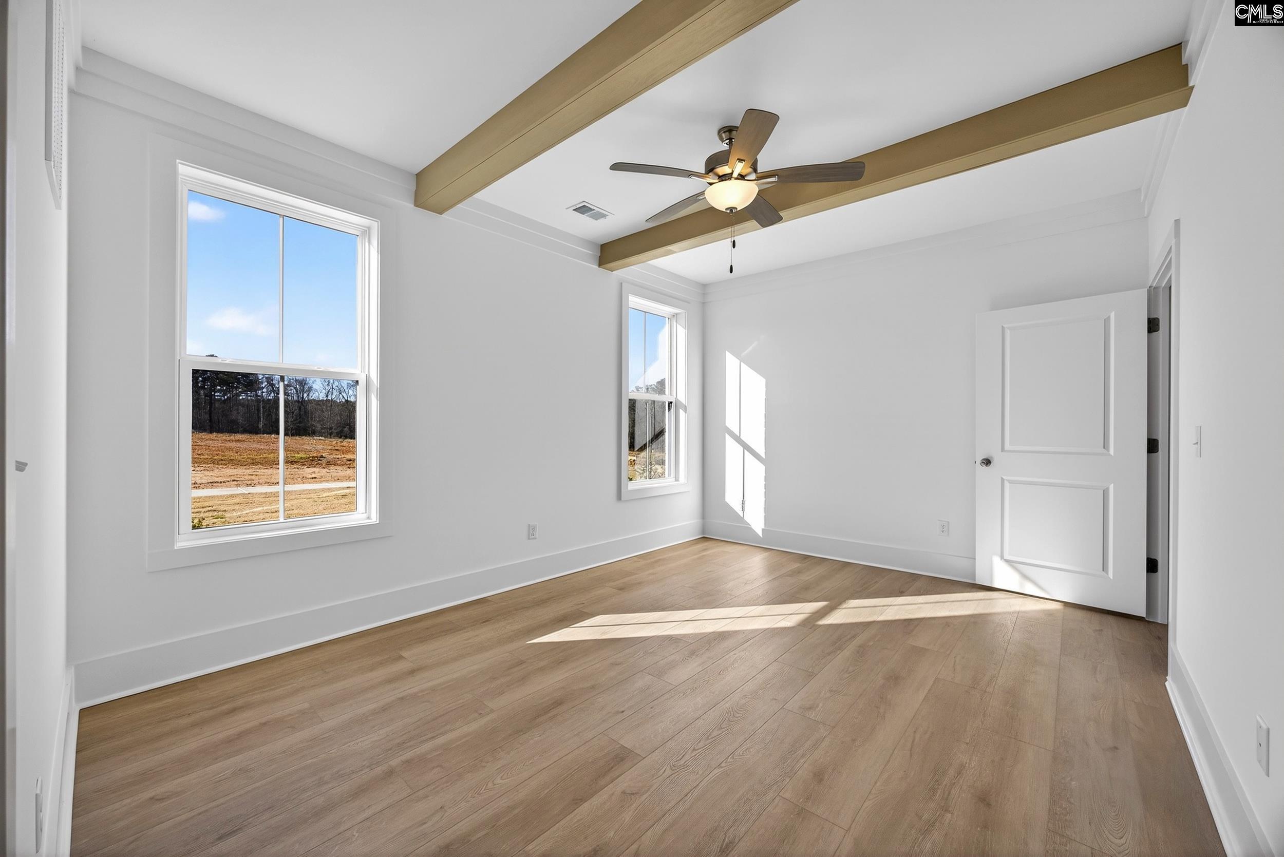 1318 Long Grove Way Lexington, SC 29072 - Photo 40 of 90 a view of an empty room with wooden floor and a window