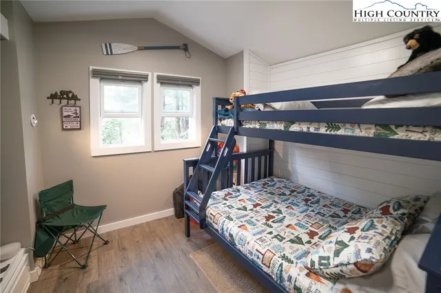 a bedroom with a bed and a bookshelf