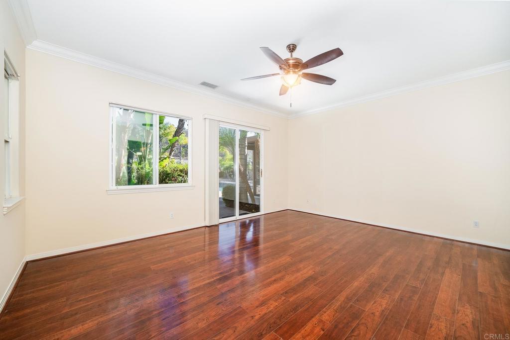 1075 Crimson Drive San Marcos, CA 92069 - Photo 12 of 74 a view of an empty room with wooden floor and a window