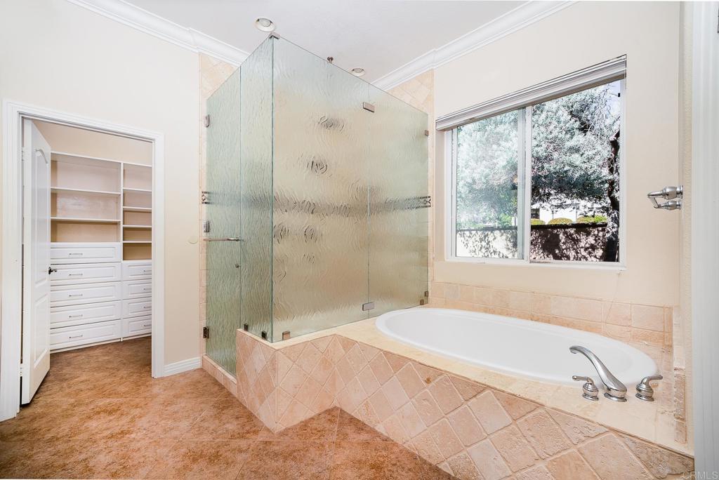 1075 Crimson Drive San Marcos, CA 92069 - Photo 15 of 74 a bathroom with a tub shower and sink